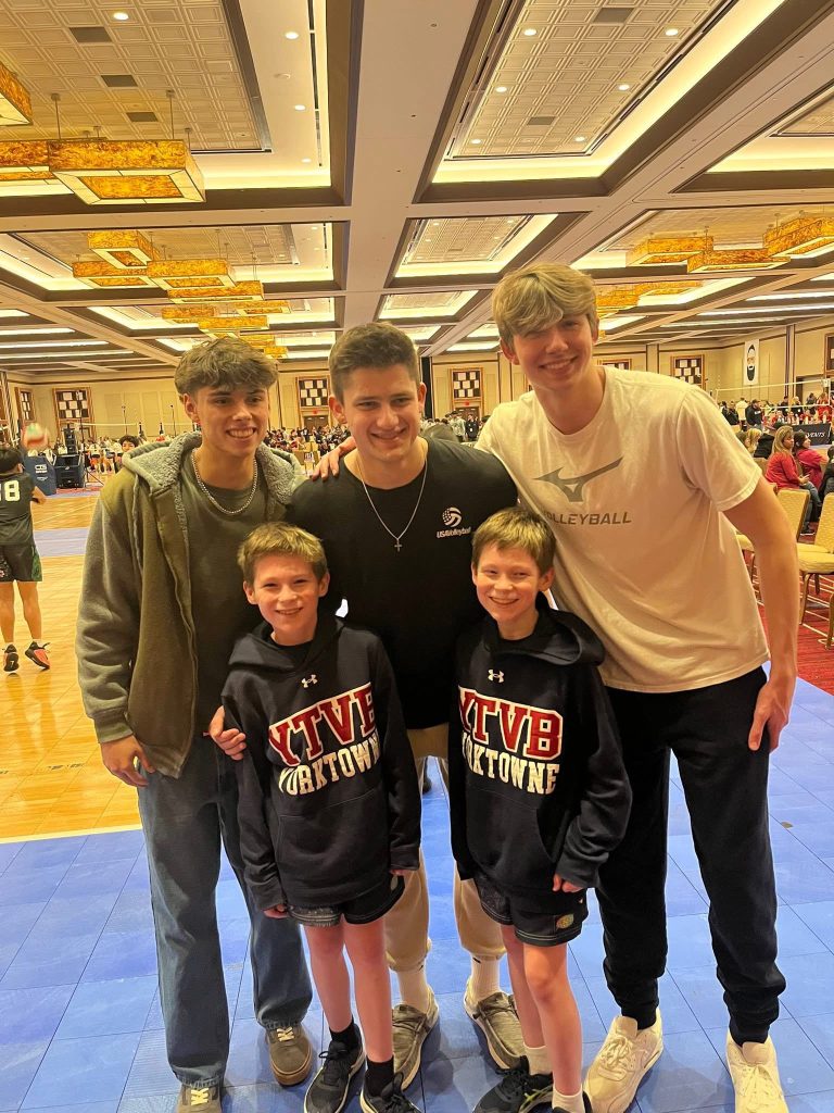 Yorktowne boys volleyball athletes and coaches gathered after competition