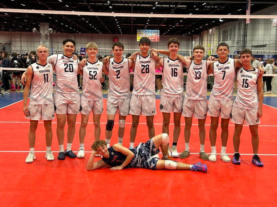 Yorktowne boys volleyball team lined up on an indoor court